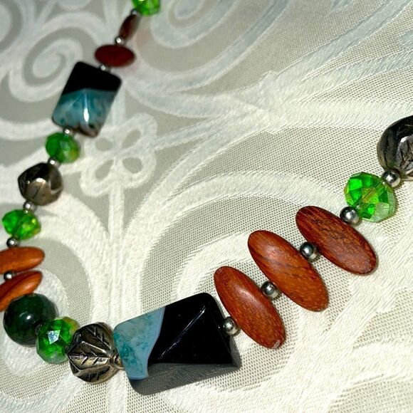 Asymmetrical bead necklace unique beads in green, blue, black, brown, & silver - Picture 2 of 7